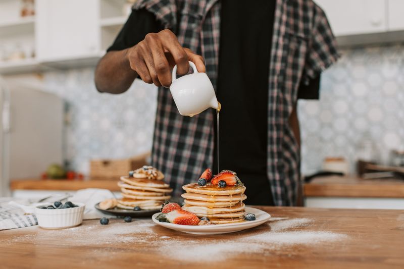 Tatte breakfast pancakes with fresh berries and syrup